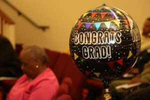 A balloon with the word 'columbia's grad' on it.