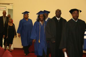 A group of people in graduation gowns and robes.